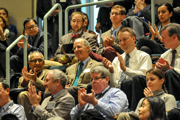 Jules Dienstag (center), the Carl W. Walter Professor of Medicine, is applauded at Medical Education Day 2014. Image: Steve Lipofsky