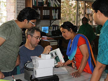 Christopher Hug (second from left) discusses sweat test procedures with research collaborators. Image: Christopher Hug