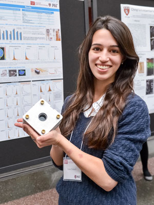 HST student Lina Colucci, who works with Michael Cima at the Koch Institute for Integrative Cancer Research at MIT, holding a portable magnetic resonance sensor that does not generate images but measures fluids in the body, revealing information about tissue. Image: Steve Lipofsky