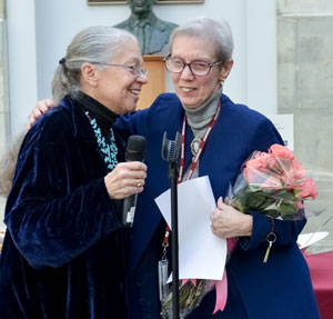 Nancy Oriol (left), former dean for students, gives a hug to Carla Fujimoto, assistant director of student affairs, who is retiring.