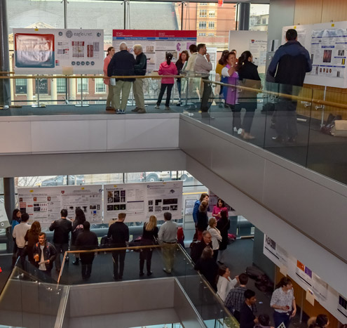 posters and people on 2 levels of nrb