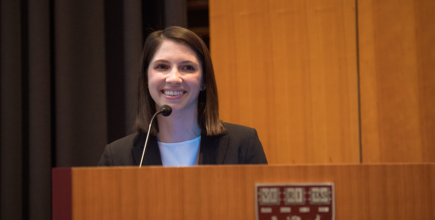 Young woman smiling at podium