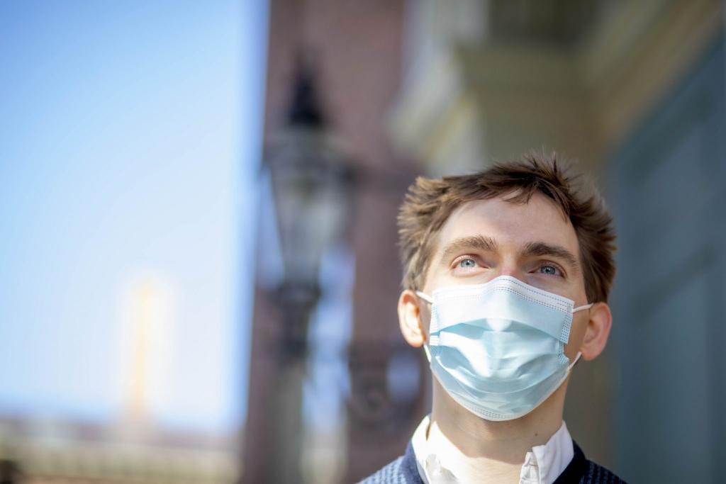 Photo portrait of Schleifer wearing a mask with blurred out background