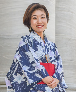 portrait of Hamaguchi in her kimono in front of Gordon Hall