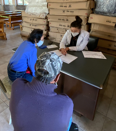 Sedas consulting with two patients