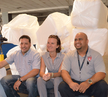 Jose Argueta, Alicia Murchie, and Oscar Gonzalez with one day's worth of Styrofoam from HIM/NRB. Photo by Angela Alberti
