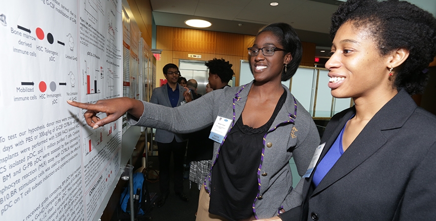 Faculty at a research poster