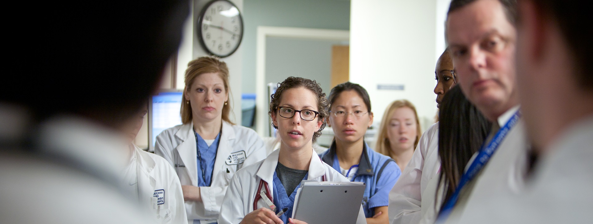 Group of doctors looking on at a lecture in clinical