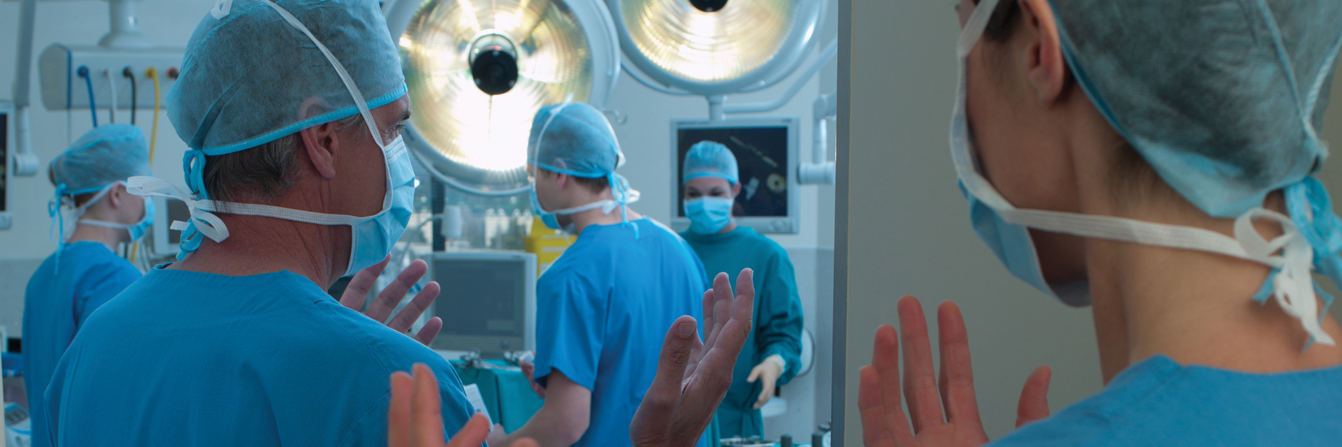 Members of surgical team entering operating theater