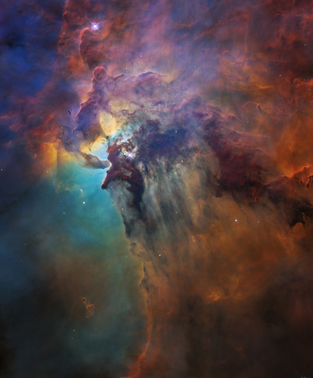 The Lagoon Nebula photographed by the Hubble Space Telescope in 2018 showing tower-like clouds surrounded by gaseous masses in which stars are formed