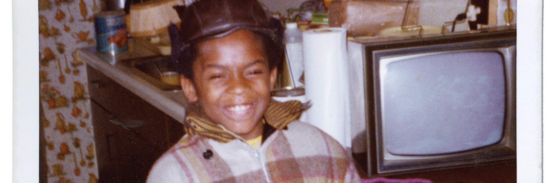 smiling child in vintage 170s photo