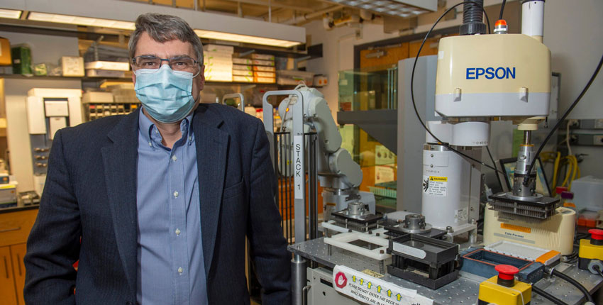 Photo of Mark Namchuk standing in a lab 