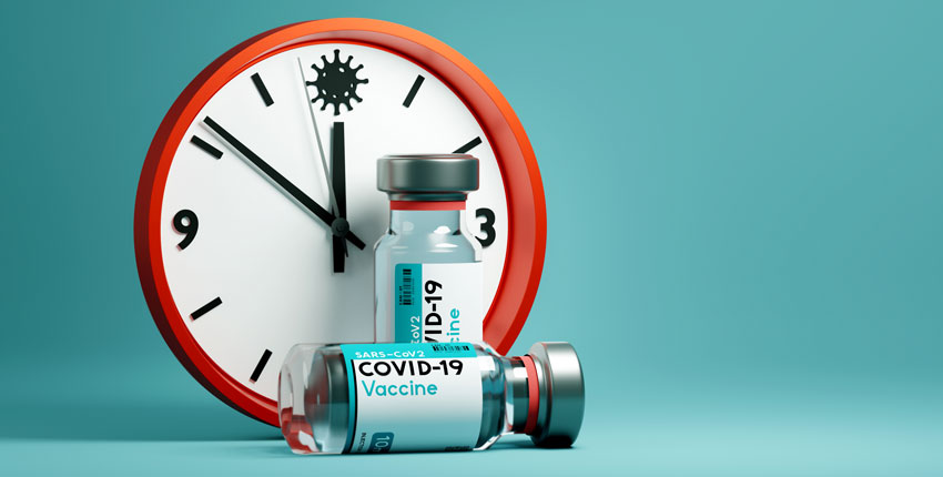 Clock and COVID vaccine vial 