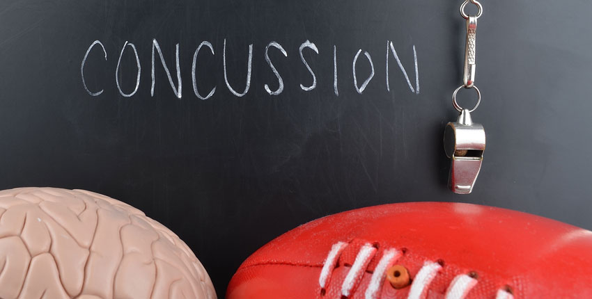Illustration of a chalkboard that reads "Concussions" with a brain and a football nearby