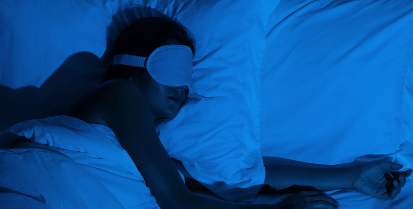 person in deep sleep with eye mask
