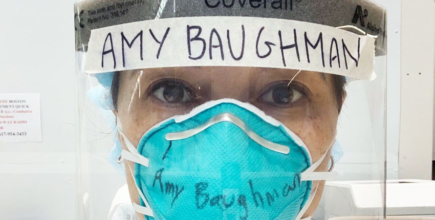 Photo of Amy Baughman, MD, in full COVID PPE, facemask, eye shield 