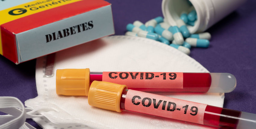 Image of COVID blood test vials with a box nearby that says 'Diabetes' 