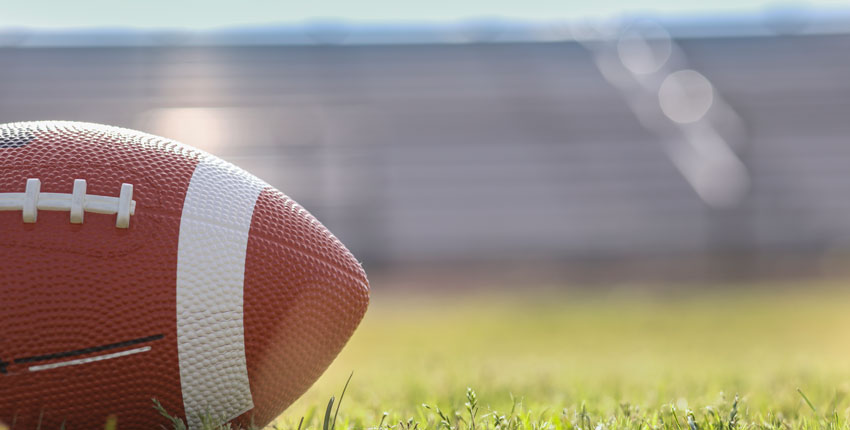Photo of a football on a grassy field
