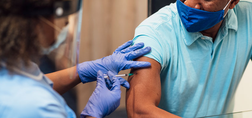 Image of a healthcare worker vaccinating a patient