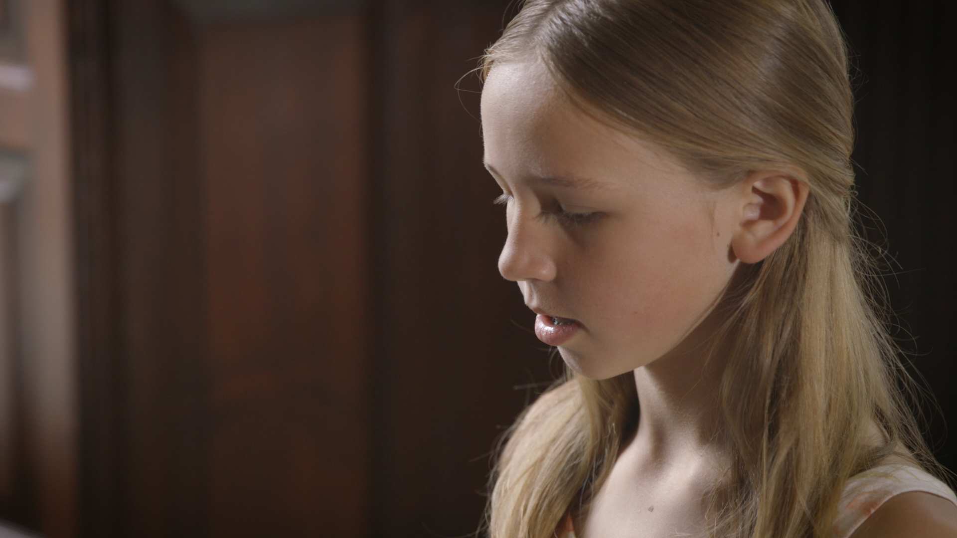 12-year-old girl playing piano