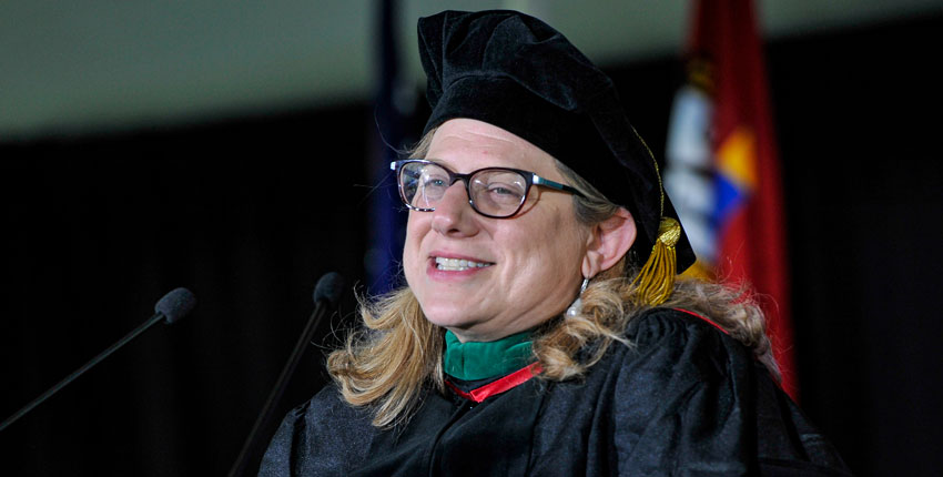 Closeup of Brendel in regalia at podium