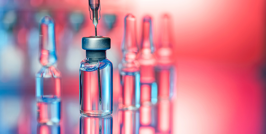Stylized photograph of unlabeled bottles of vaccine