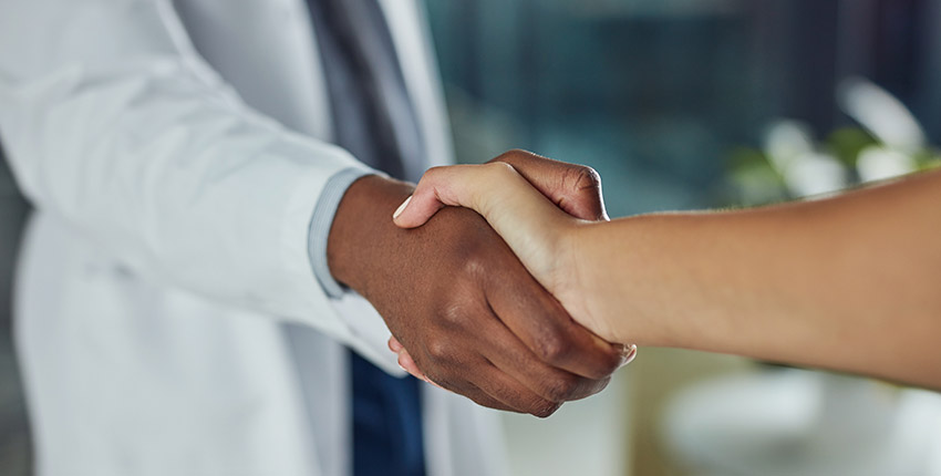 Doctor shaking hand with a patient 