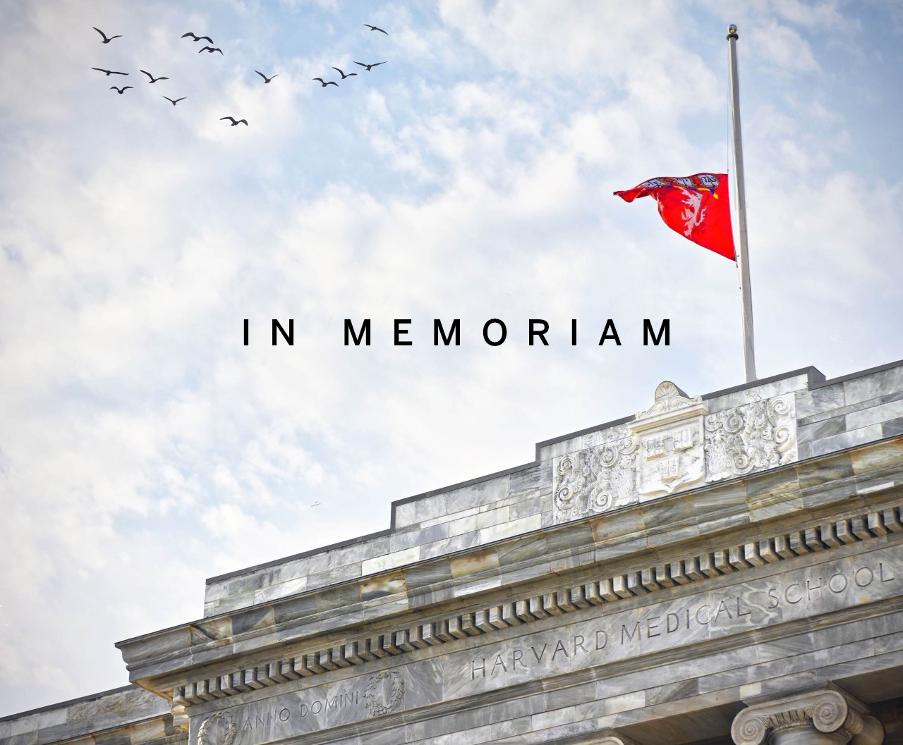 A flag raised at half-staff above Gordon Hall