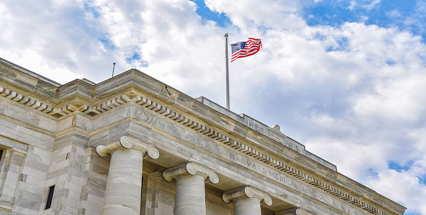 American flag flying above Gordon Hall on the HMS Quad. Image: Steve Lipofsky