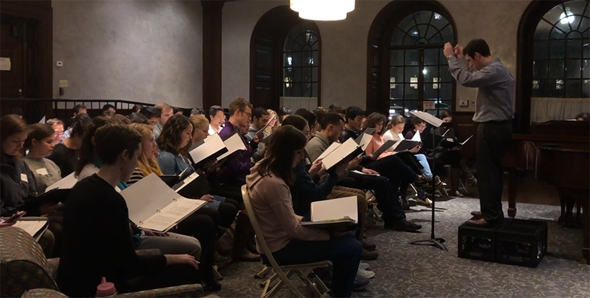 chorus rehearsing in Vanderbilt Hall