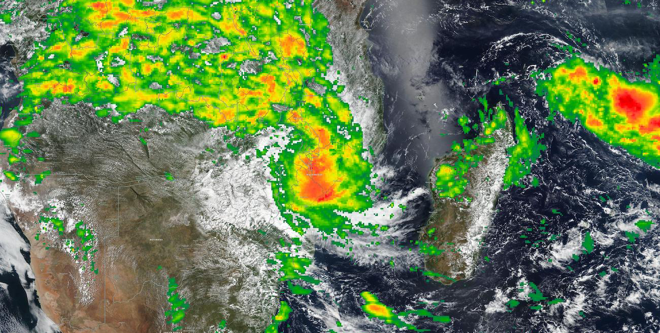 A satelite image of a swirling storm above Malawi and Madagascar, with bands of green, yellow, orange and red showing increasingly intense rainfall.