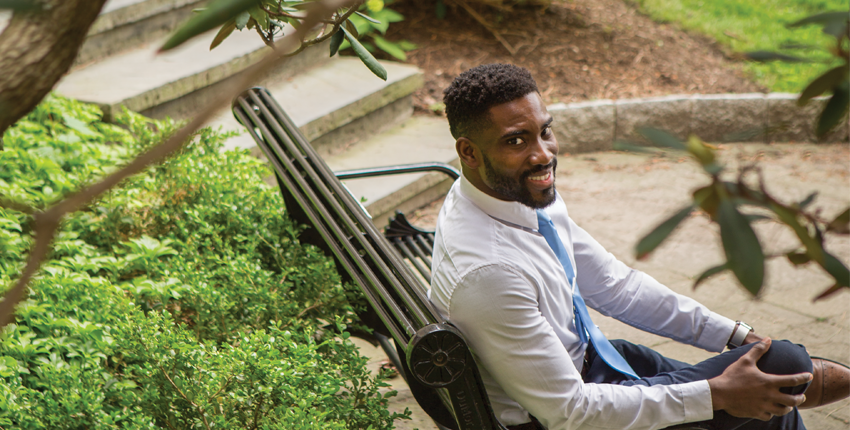 Photo of Nwanaji-Enwerem on a bench in a park