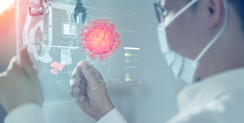 Charts, xrays and other medical appear on a screen with a coronavirus particle superimposed in front of it.