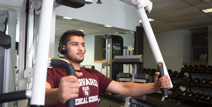 photo of Zaki lifting weights on a chest press machine