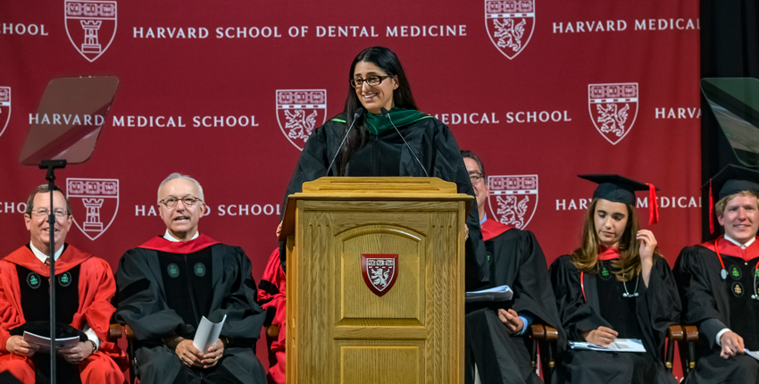 Mona Hanna-Attisha infront of the podium addressing the crowd