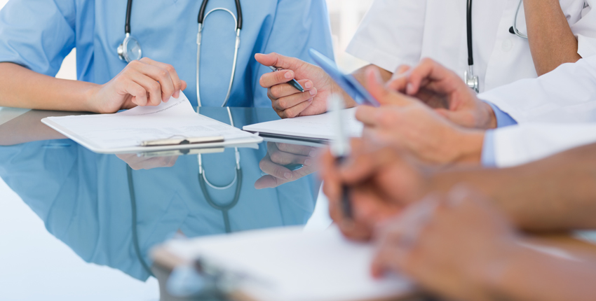 Generic photo of health care workers holding clipboards 