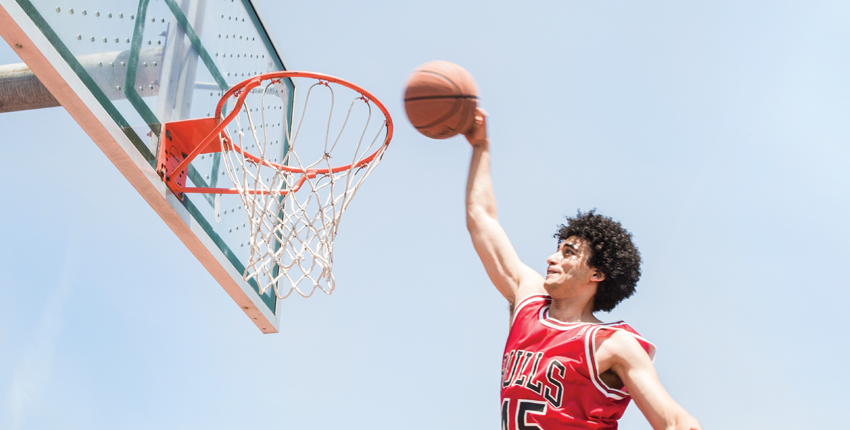 Photo of Amen dunking a basketball