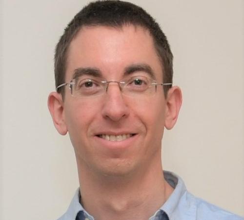 Head shot of Shai Carmi, a man with glasses and short dark hair