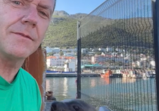 Blaise Aguirre with a sea lion