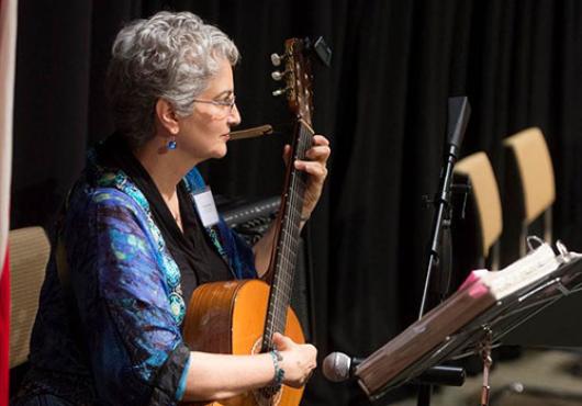 Marcia Feldman playing guitar