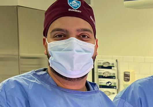 Savo Bou Zein Eddine in hospital scrubs and face mask