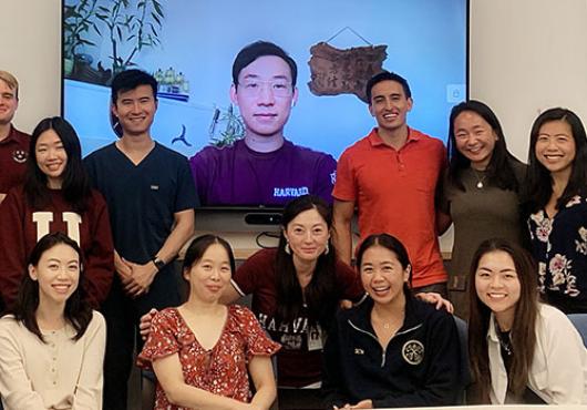 Photo of Shasha Li (center) with students