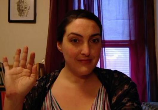 Rachael Jonas-Closs waving on Zoom
