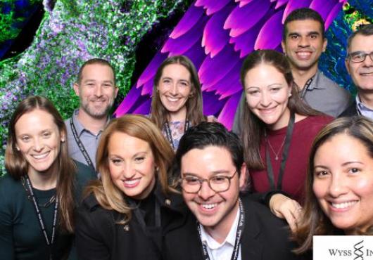 Ana Villar de Jimenez with a group of people at a Wyss Institute retreat