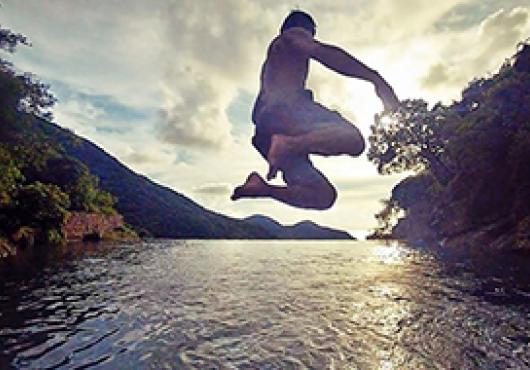 Chan jumping into the Tai O Infinity Pool while traveling in Hong Kong. Image: Will Chan
