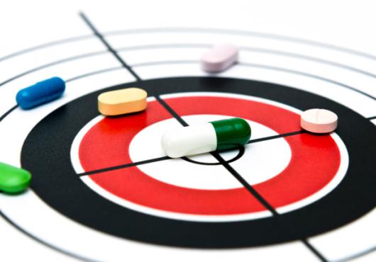Drawing of a target with pills on lying on top