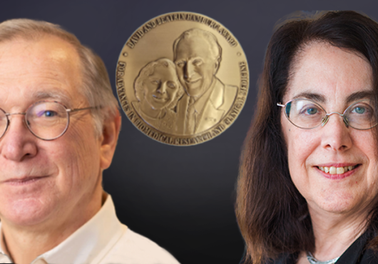 Gordon Freeman and Arlene Sharpe with the Hamburg Award on a dark background