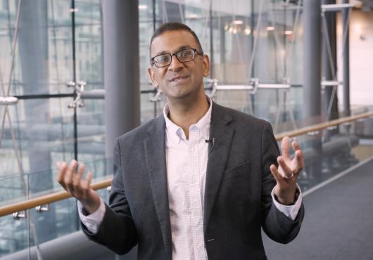 Vijay Sankaran being interviewed inside the New Research Building at Harvard Medical School.