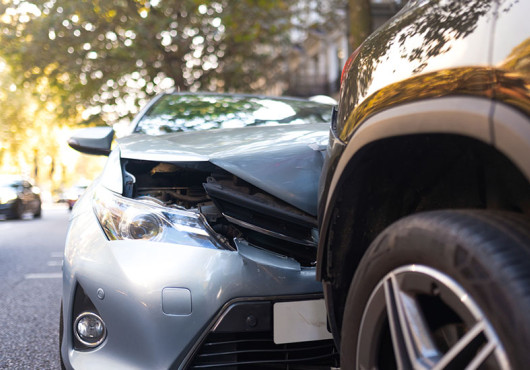 Two cars in a head-on collision. 