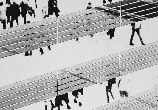 abstract, grayscale image of people walking